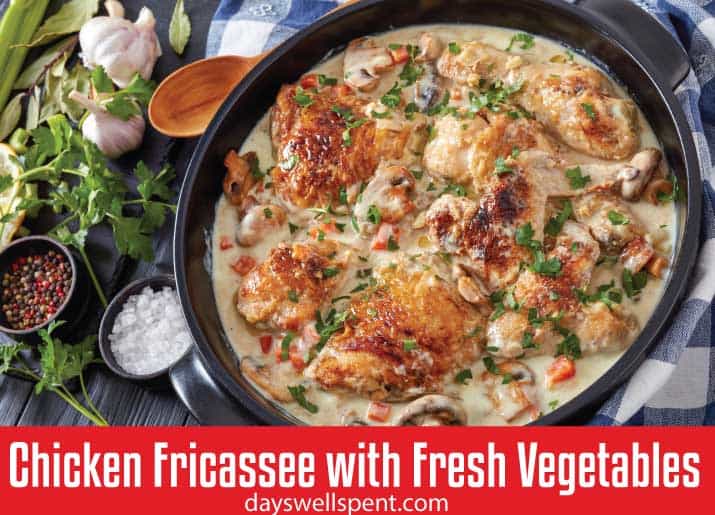 CHICKEN FRICASSEE IN CREAMY SAUCE WITH FRESH VEGETABLES in cast iron pan